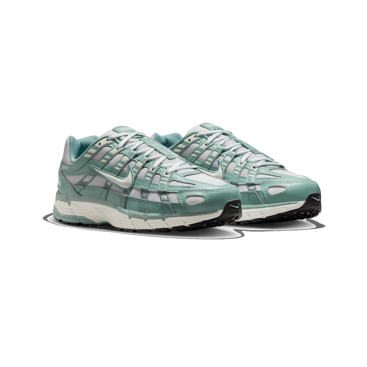 A pair of teal-green and light grey Nike P-6000 sneakers angled side by side, showing the mesh and leather upper panels, white Swoosh logos, and white midsole with black outsole.