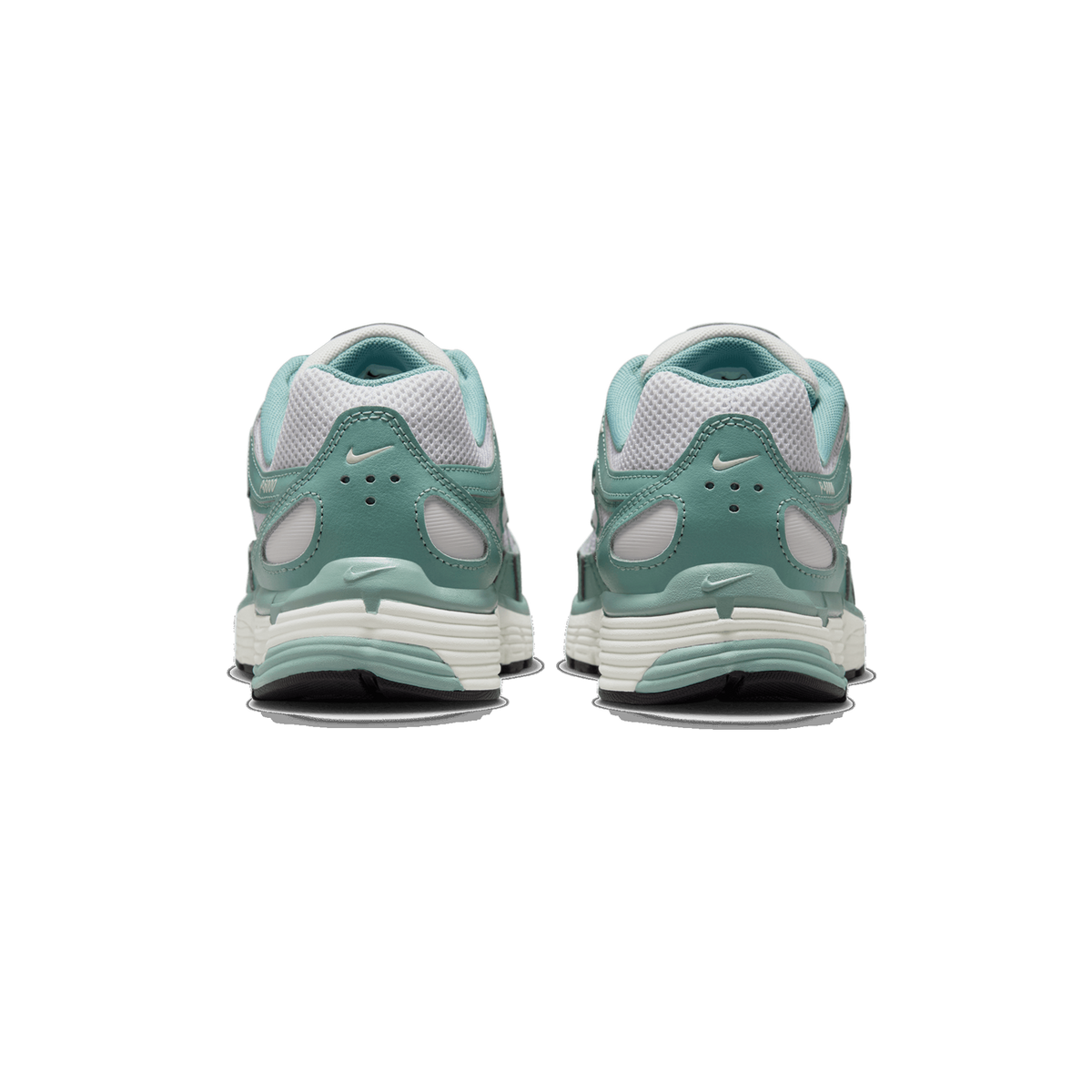 Rear view of a pair of teal-green and light grey Nike P-6000 sneakers standing side by side on a white background, showing the heel counters with Nike swoosh logos and the cream-colored midsoles.