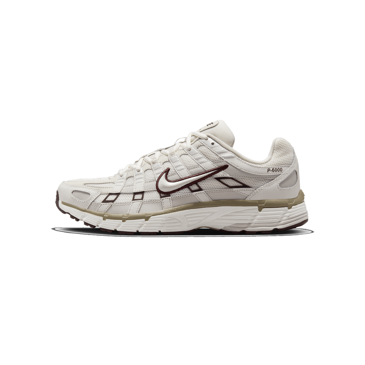 Side profile of a cream-white Nike P-6000 sneaker with a toe pointing left, showing a dark brown outlined Swoosh logo, brown trim accents, a tan midsole stripe, and a 'P-6000' label on the heel panel.