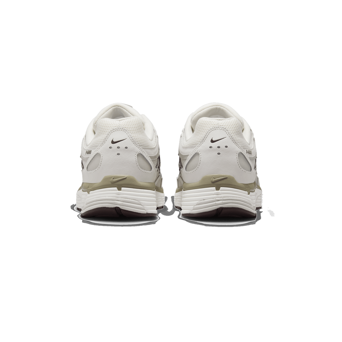 Rear view of a pair of Nike P-6000 sneakers in cream, beige and brown tones, showing the heel counters with the Swoosh logo and the P-6000 text, and the sage-beige heel accents above white midsoles with dark brown outsole edges.