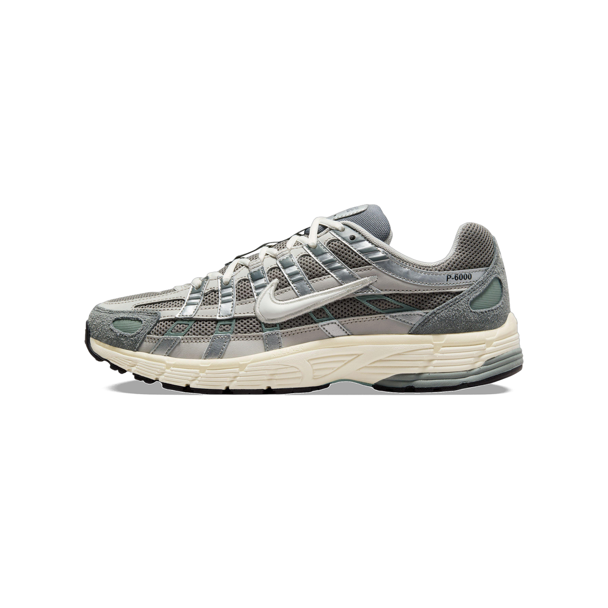 Side view of a gray and silver Nike P-6000 sneaker with a white swoosh, mesh panels, cream midsole, and toe pointing left.