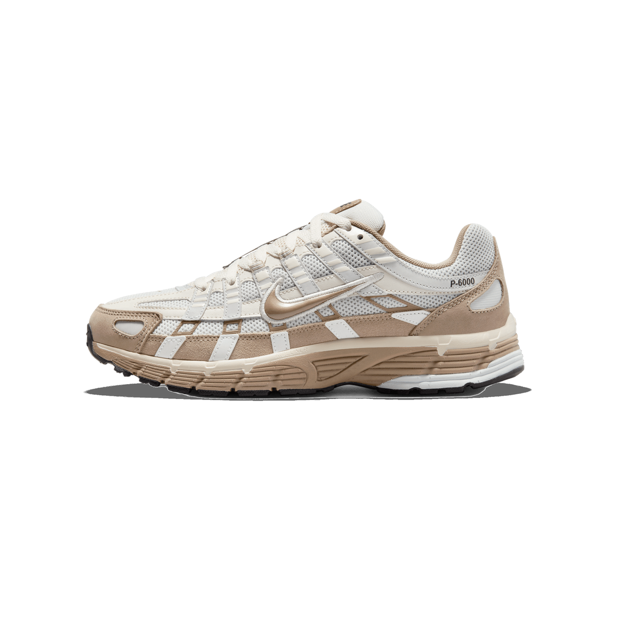Single Nike P-6000 sneaker in profile, toe pointing left, showing a cream and tan mesh and suede upper with a tan-embroidered Swoosh logo and P-6000 text on the heel panel.