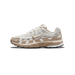 Single Nike P-6000 sneaker in profile, toe pointing left, showing a cream and tan mesh and suede upper with a tan-embroidered Swoosh logo and P-6000 text on the heel panel.