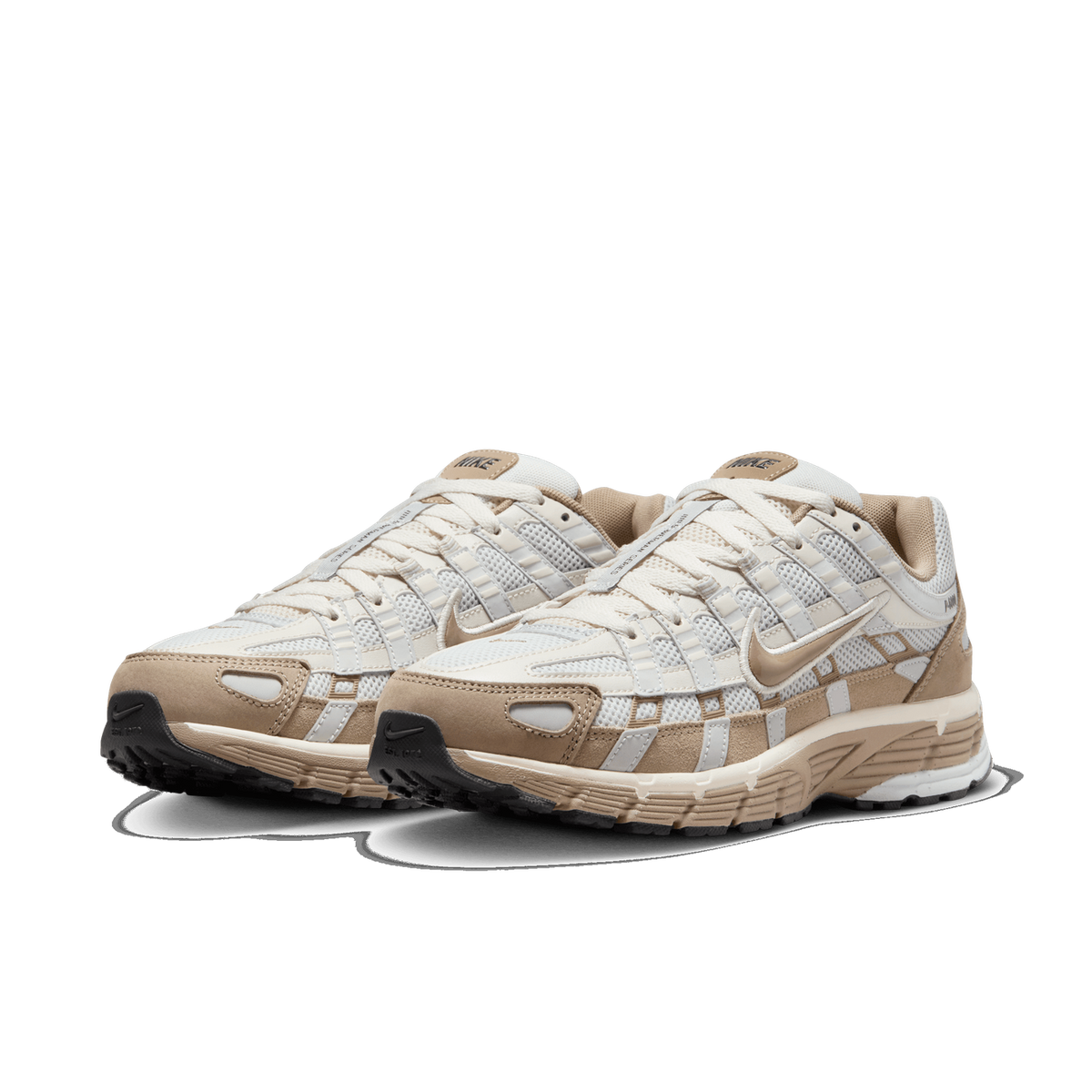 A pair of beige and tan Nike P-6000 sneakers shown side by side at an angle, with white mesh panels, tan suede overlays, and tan Swoosh logos on the sides.