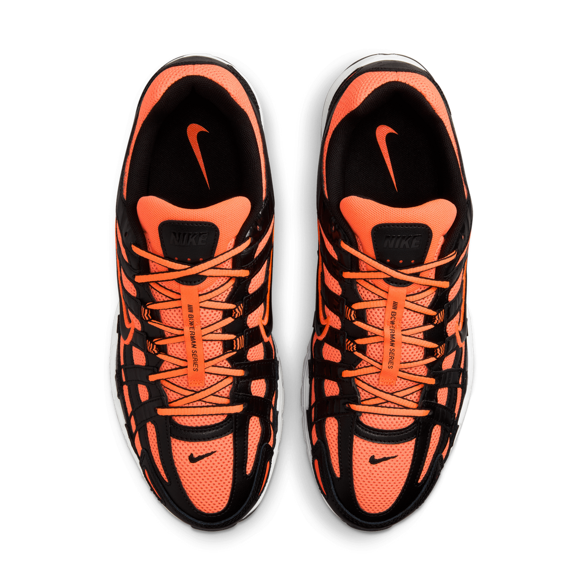 Top-down view of a pair of orange and black Nike P-6000 sneakers placed side by side on a white background, showing the laces, tongues with Nike branding, and the mesh and overlay panels.