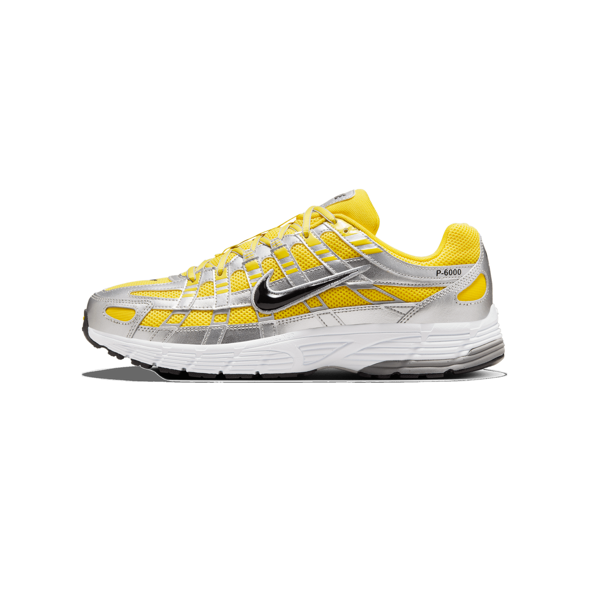 A single yellow and silver Nike P-6000 sneaker shown in side profile with the toe pointing left, displaying a black Swoosh logo and 'P-6000' text on the heel, with a white midsole and silver metallic overlays.