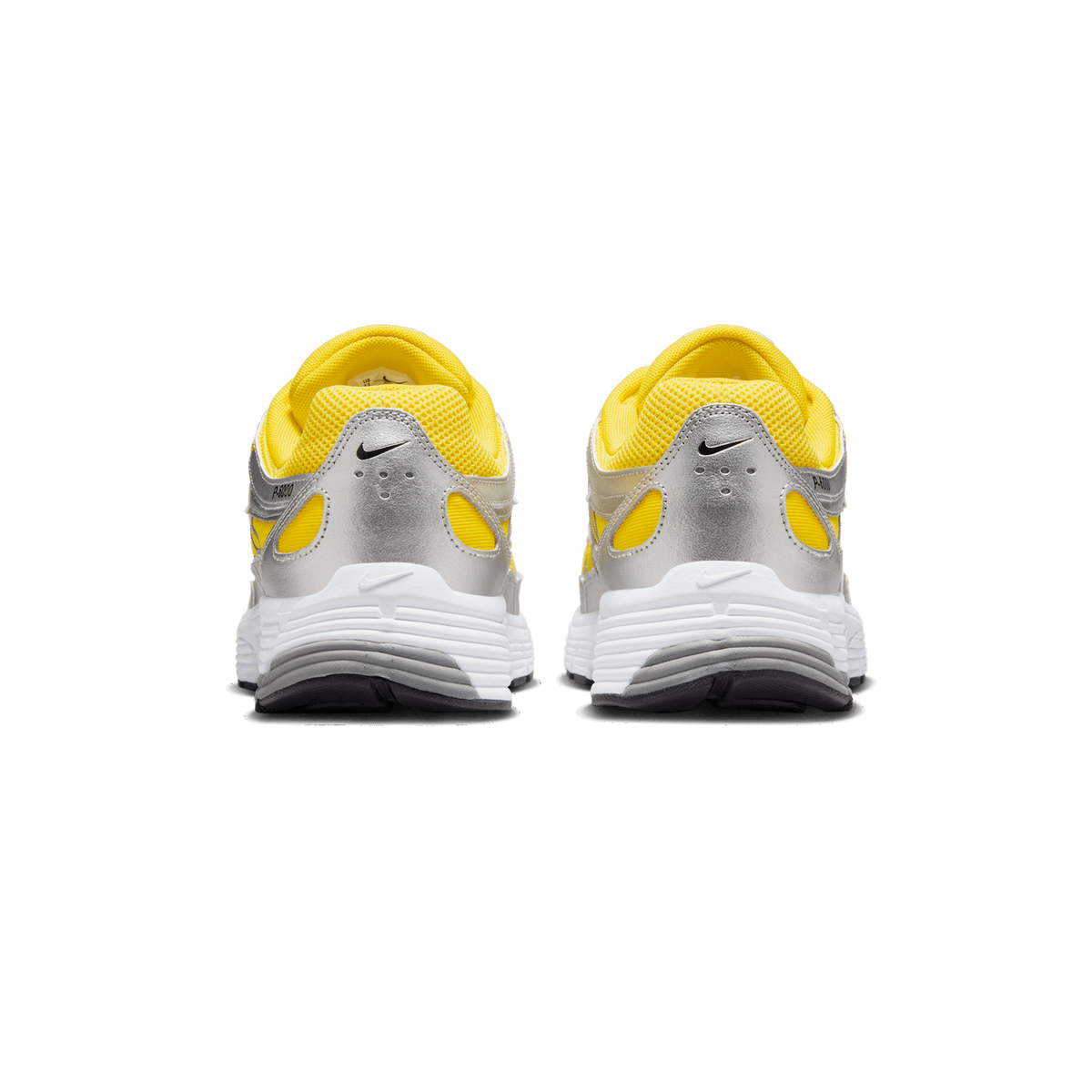 Rear view of a pair of yellow and metallic silver Nike P-6000 sneakers with white midsoles, shown side by side with their heels facing the camera.