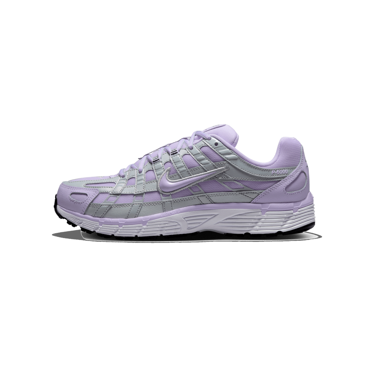 Side profile of a lilac and silver Nike P-6000 sneaker with the toe pointing left, showing the lilac Swoosh logo, silver overlay panels, and white midsole with the P-6000 branding on the heel.