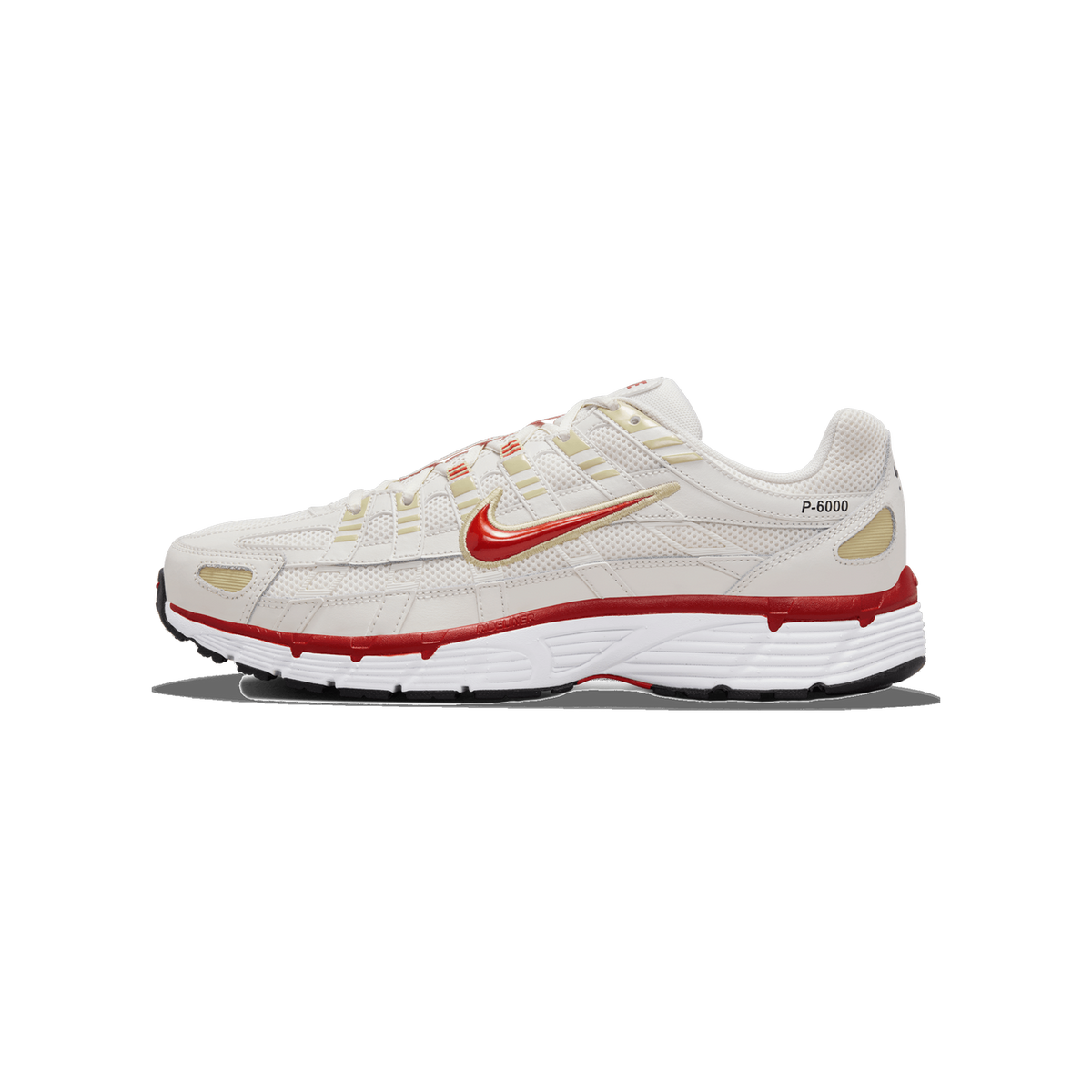 Single Nike P-6000 sneaker shown from the lateral side with the toe pointing left, featuring a cream and off-white upper, a red Swoosh logo with gold stitching, red and white midsole, and a P-6000 label on the heel.