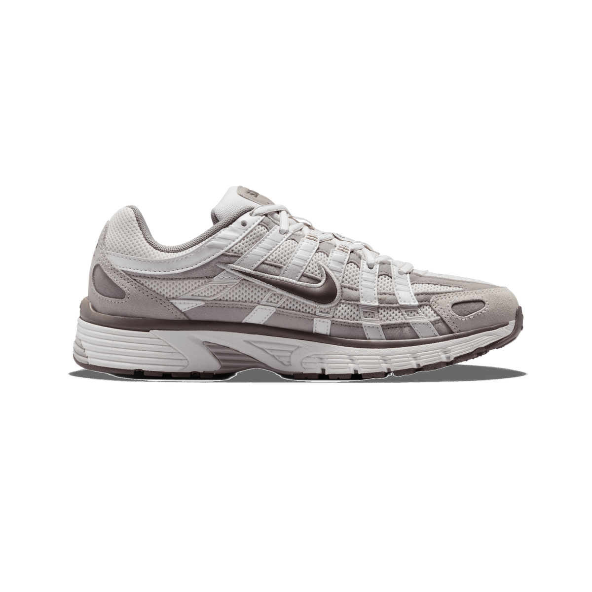 A single Nike P-6000 sneaker in a light grey and brown colourway, shown from the outside with the toe pointing left, featuring a mesh and suede upper, white laces, and a brown Swoosh logo on the side.