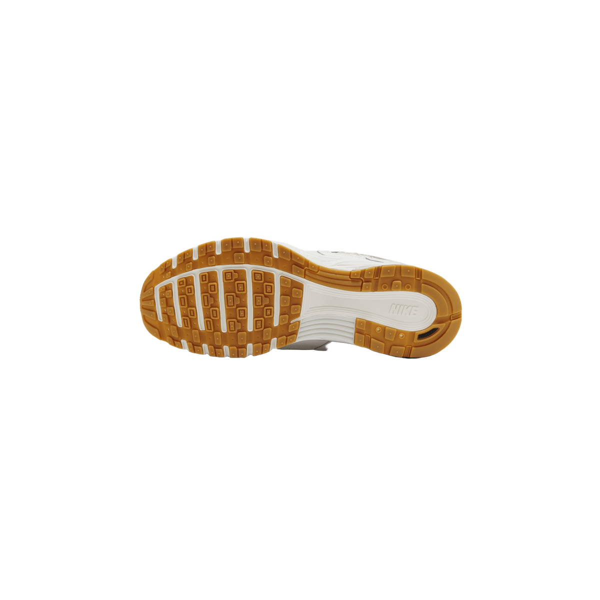 Underside of a white Nike P-6000 sneaker showing the cream-colored midsole with a tan-gold rubber outsole pattern of square lugs, with the Nike logo visible on the sole.