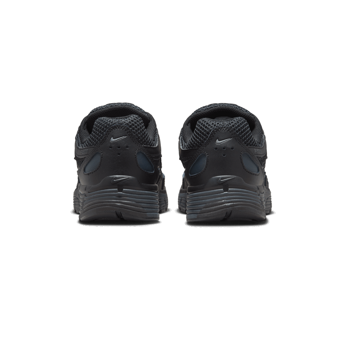 Rear view of a pair of black Nike P-6000 sneakers standing side by side on a white background, showing the heel tabs, Swoosh logos, and mesh collars.