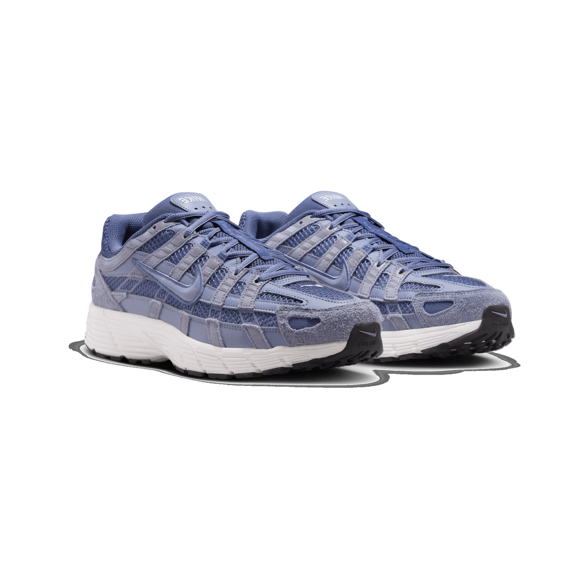A pair of blue and gray Nike P-6000 sneakers angled side by side, showing mesh and suede panels, Swoosh logos on the sides, and white midsoles with dark outsoles.