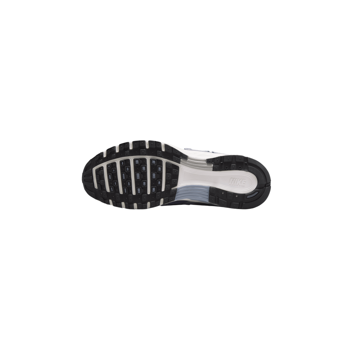 Underside of a Nike P-6000 sneaker showing a black lugged outsole with white and blue-grey accents, the Nike wordmark on the white midsole, and the heel of the shoe at the right.
