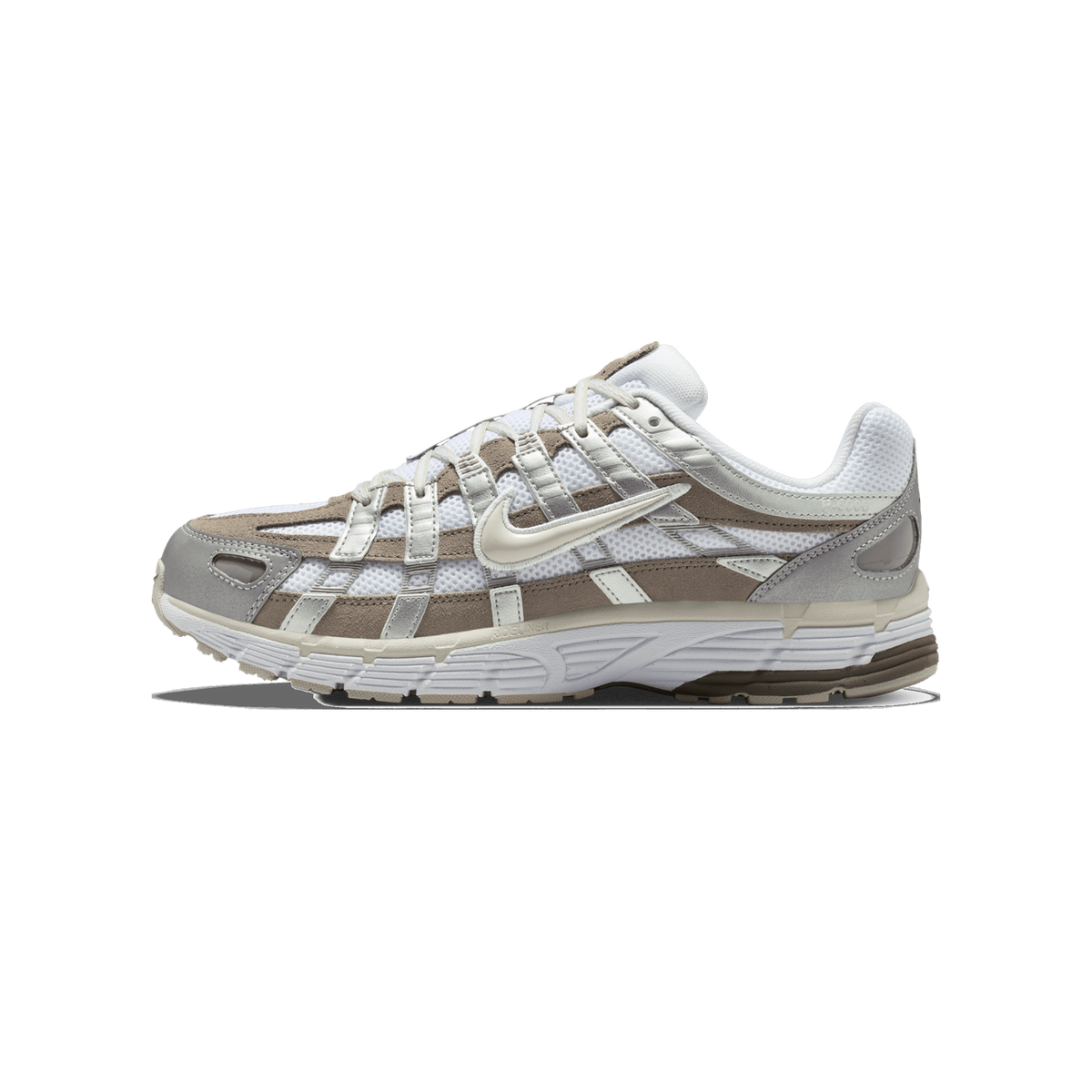Side view of a white, brown, and grey Nike P-6000 sneaker with toe pointing left, showing caged overlay panels and a textured midsole.