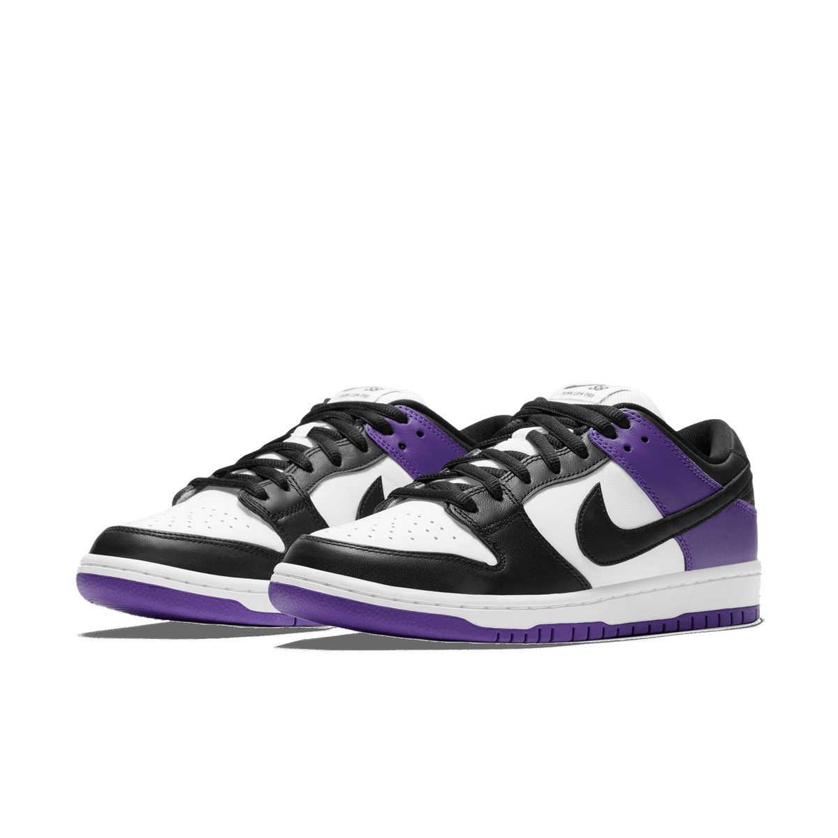 Pair of Nike SB Dunk Low sneakers in white, black, and purple, angled toward the left with black swoosh logos and purple heel tabs.