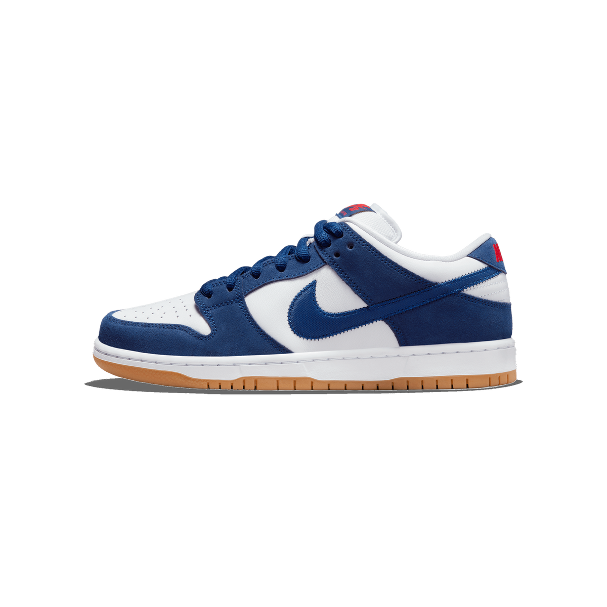 Side view of a navy blue and white Nike SB Dunk Low sneaker with a gum rubber outsole and red text on the heel tab, toe pointing left.