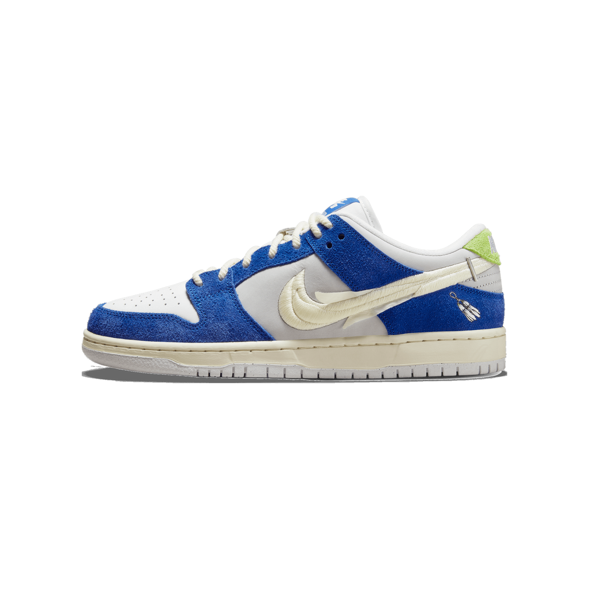 Side view of a left Nike SB Dunk Low sneaker in blue suede and white leather with an oversized cream stitched swoosh and a green heel tab