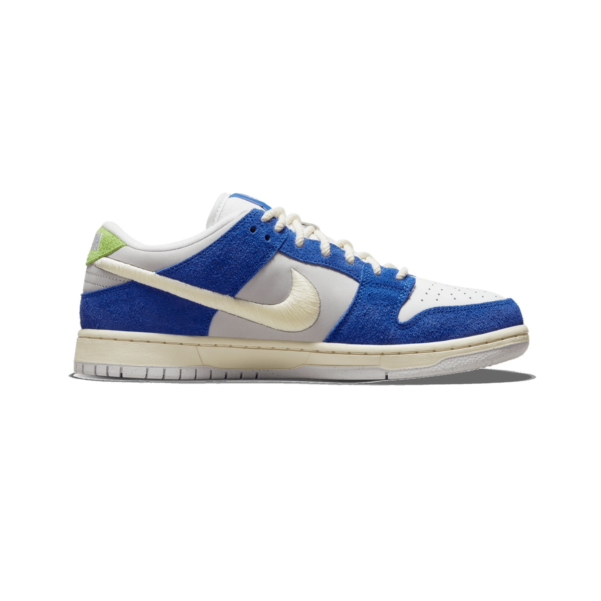 Side view of a left Nike SB Dunk Low sneaker with blue suede overlays, grey leather base, cream swoosh and laces, and a green tab at the heel, toe pointing left.
