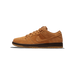 Left side view of a wheat-tan suede Nike SB Dunk Low with a dark brown midsole and gum rubber outsole, toe pointing left.