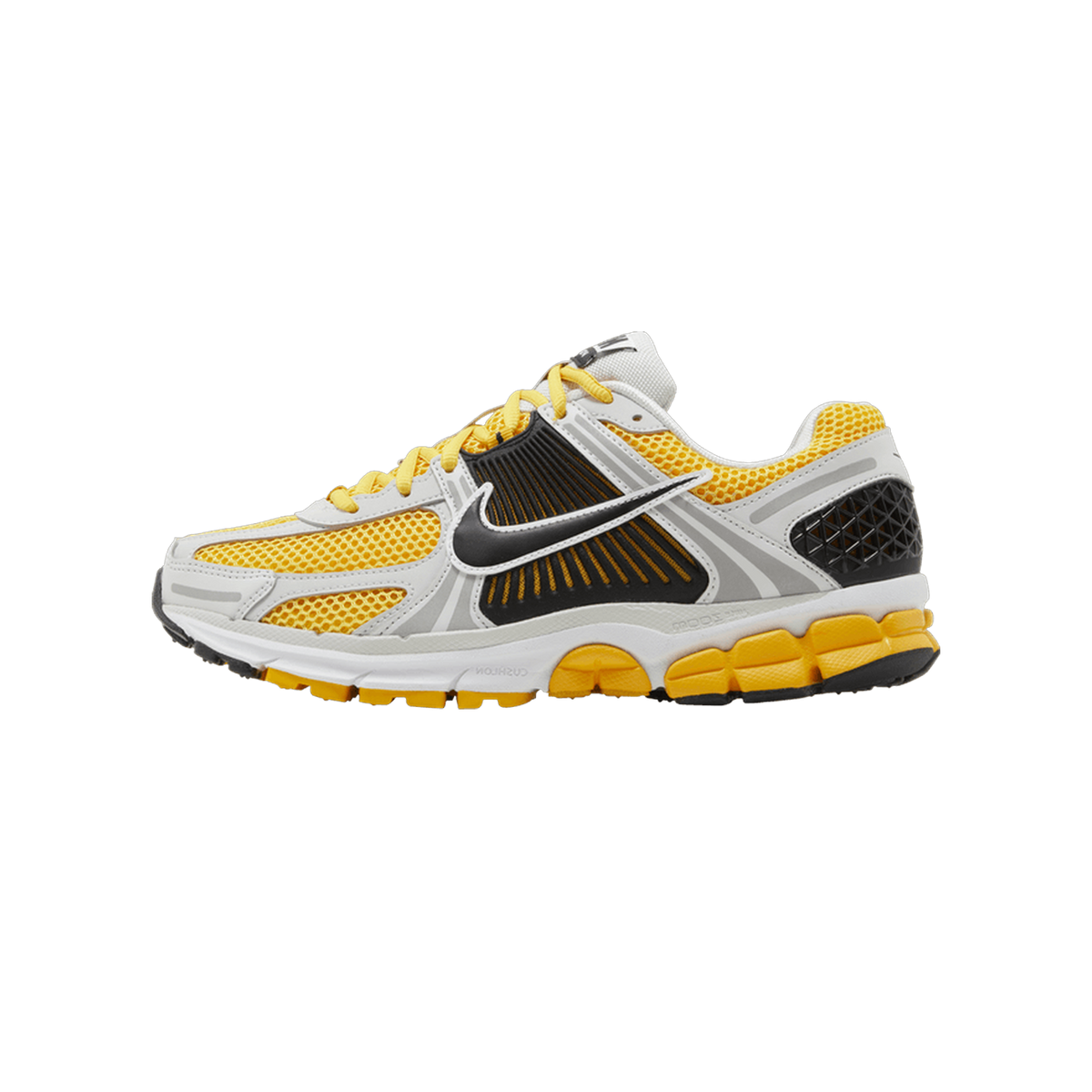 Side view of a yellow, white, and black Nike Zoom Vomero 5 running shoe with toe pointing left, showing the Swoosh logo and ridged midfoot panel
