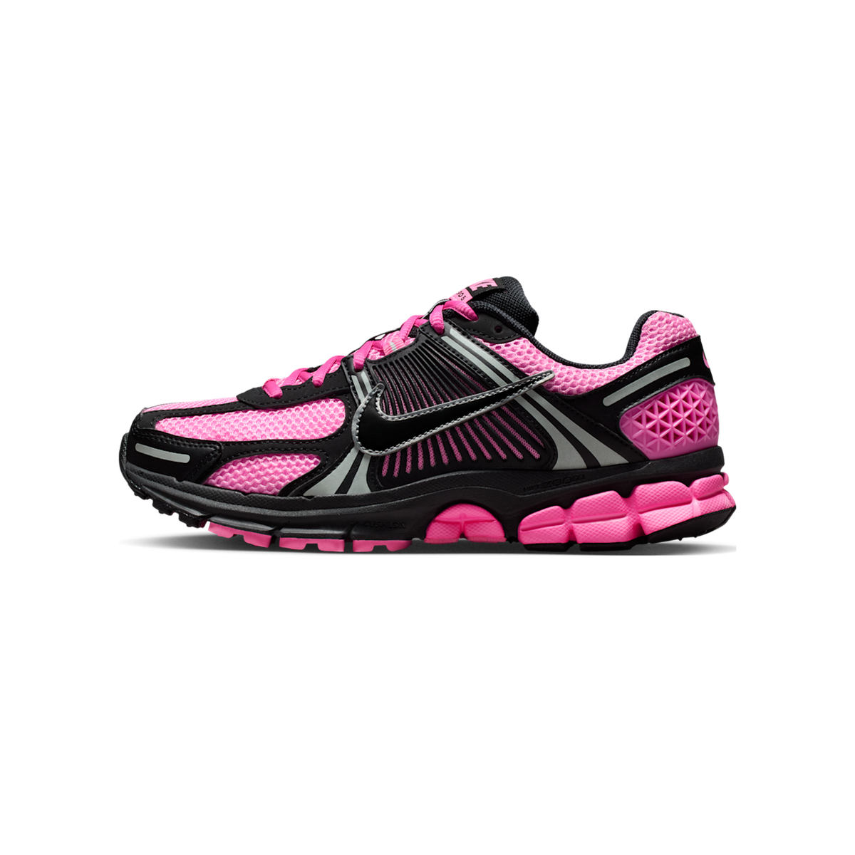 Side view of a Nike Zoom Vomero 5 running shoe in pink and black with mesh upper, silver reflective accents, and a chunky segmented pink midsole.