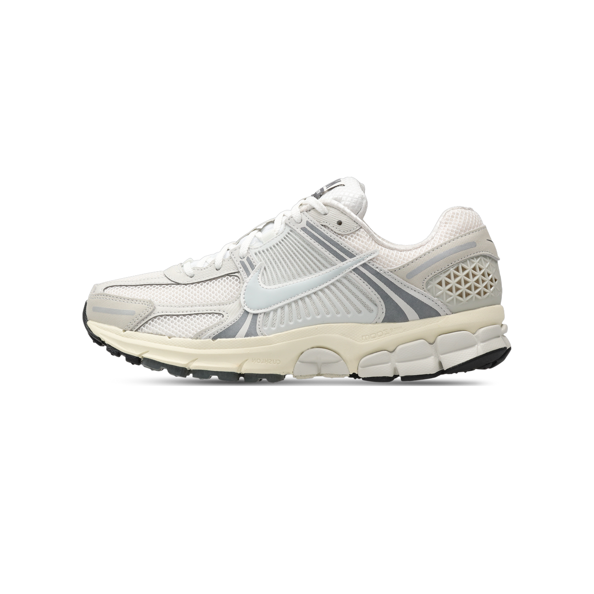 Side view of a white and gray Nike Zoom Vomero 5 sneaker with mesh upper, textured toe panel, and cream midsole with black outsole