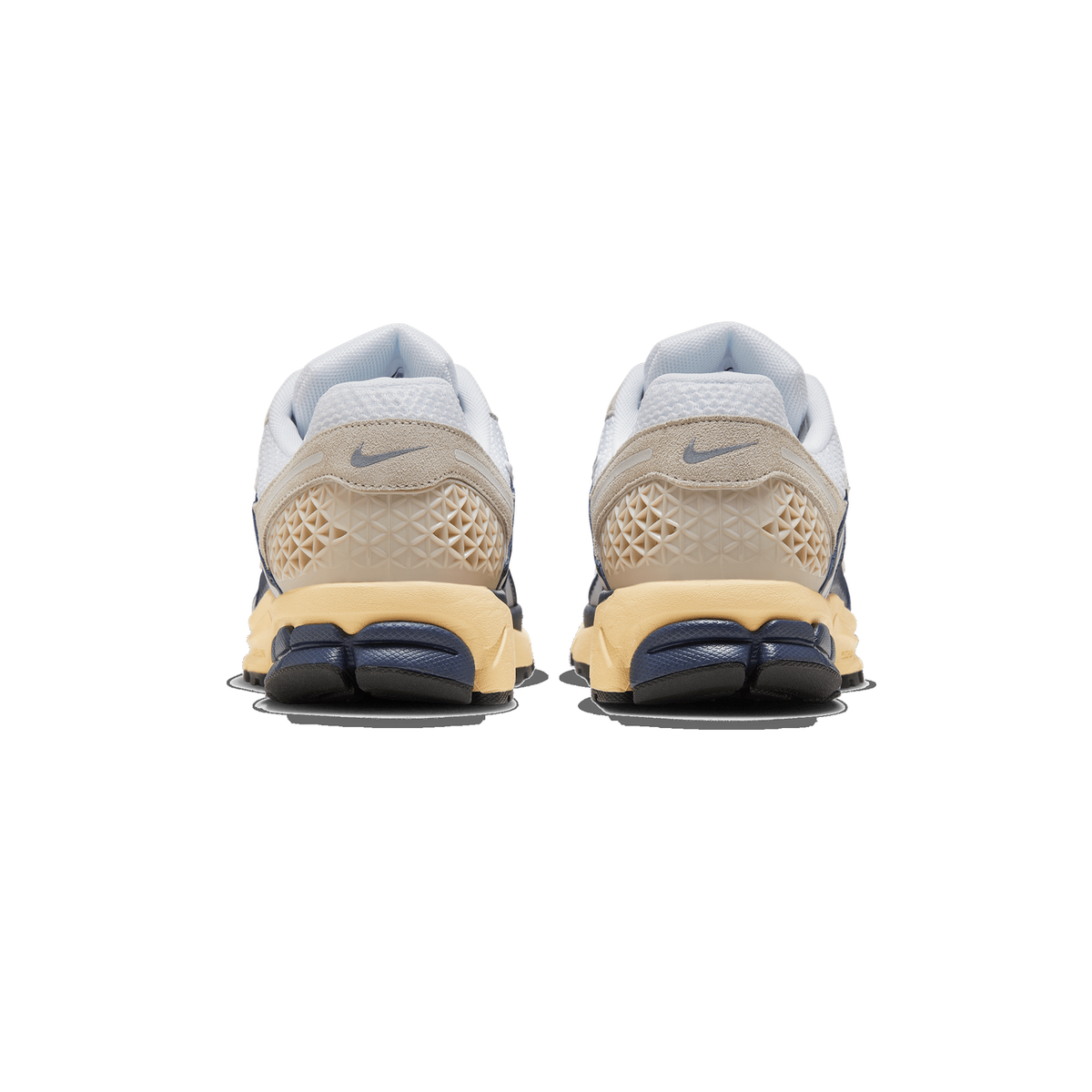 Rear view of a pair of Nike Zoom Vomero 5 sneakers in blue, cream and white with visible heel Swoosh logos and textured midsole panels