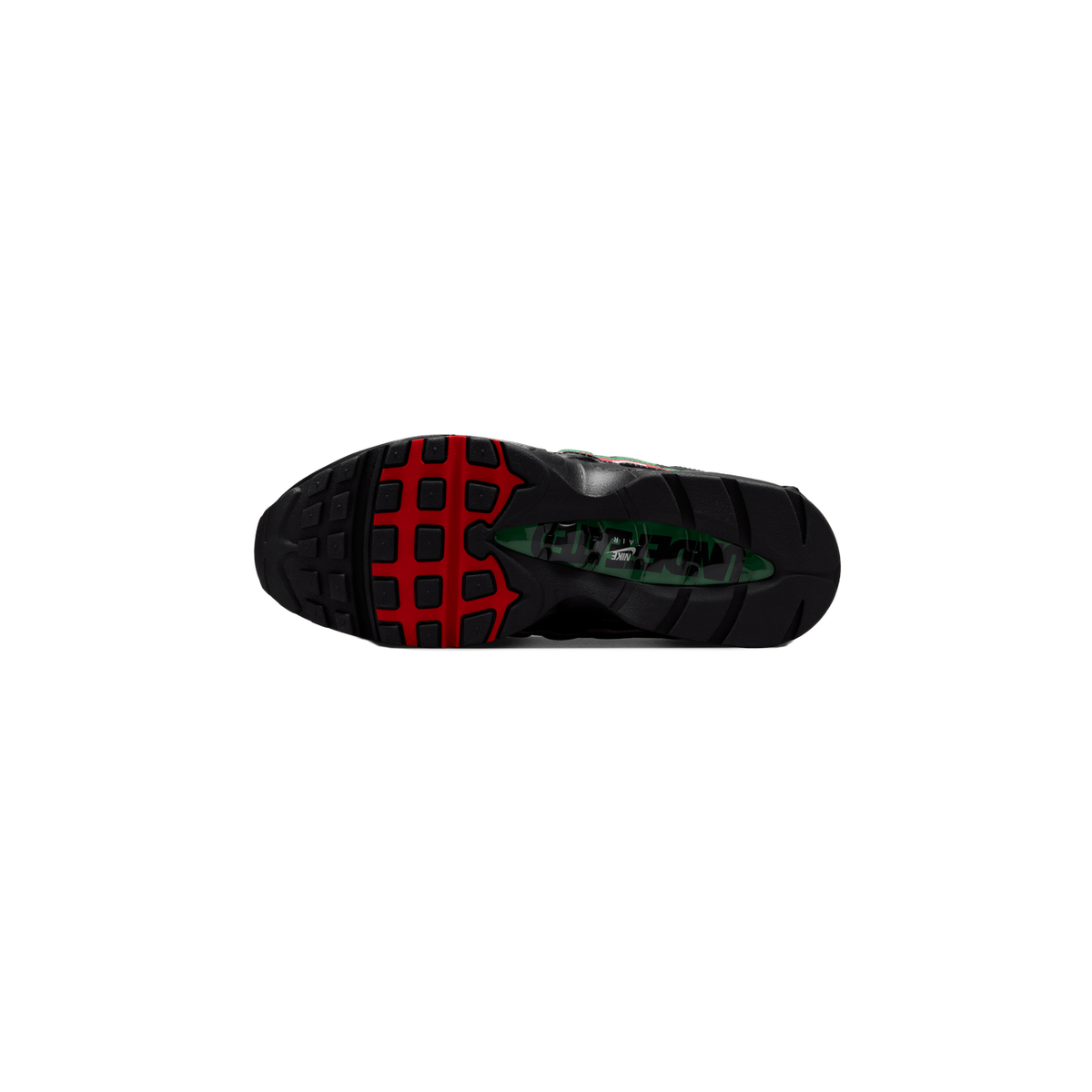 Underside of a black Nike Air Max 95 shoe showing the red and black lugged outsole, with a green Air unit visible in the midfoot cutout bearing the Nike swoosh and Undefeated lettering.