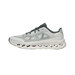 Side view of an ivory and olive green On Running Cloudtilt sneaker with a perforated CloudTec sole and green laces and heel panel.