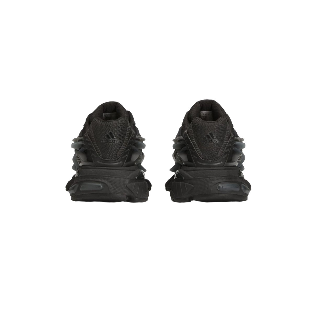 Rear view of a pair of black Adidas Pharrell Adistar Jellyfish sneakers showing the heel counters with adidas logo and chunky ridged midsoles