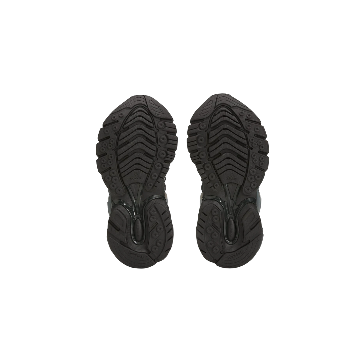 Bottom view of a pair of black Adidas Adistar Jellyfish sneakers showing the textured rubber outsole tread pattern and adiWEAR branding
