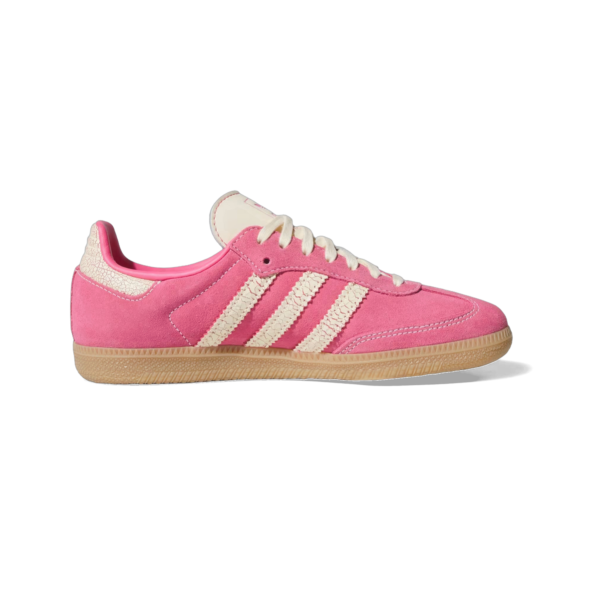 Side view of a pink suede adidas Samba sneaker with cream cracked-texture stripes, cream laces, and a gum rubber sole