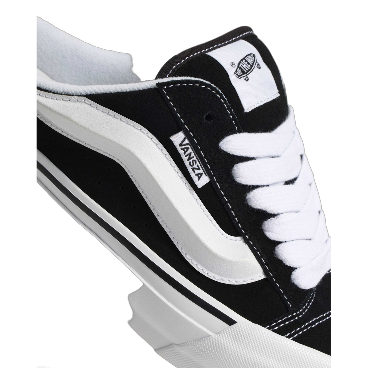 Close-up of the black suede heel and lace area of a Vans SZA Knu Skool Mule, showing the white side stripe, VANSZA tab, and Off The Wall heel patch.