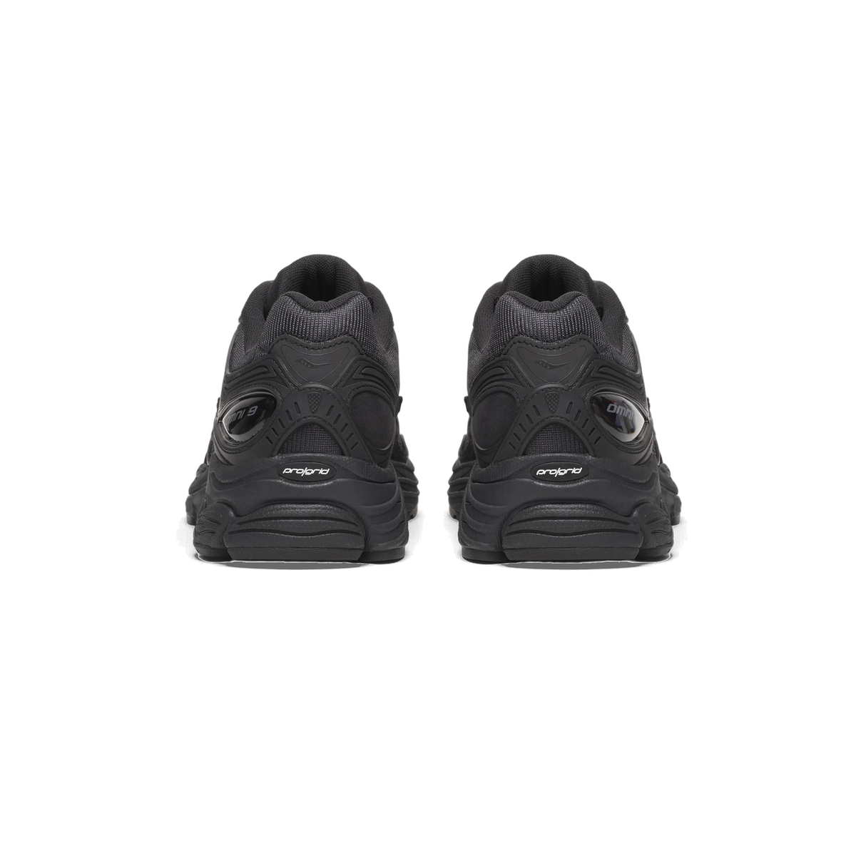 Rear view of a pair of black Saucony ProGrid Omni 9 sneakers showing the heel panels with Omni 9 and ProGrid branding