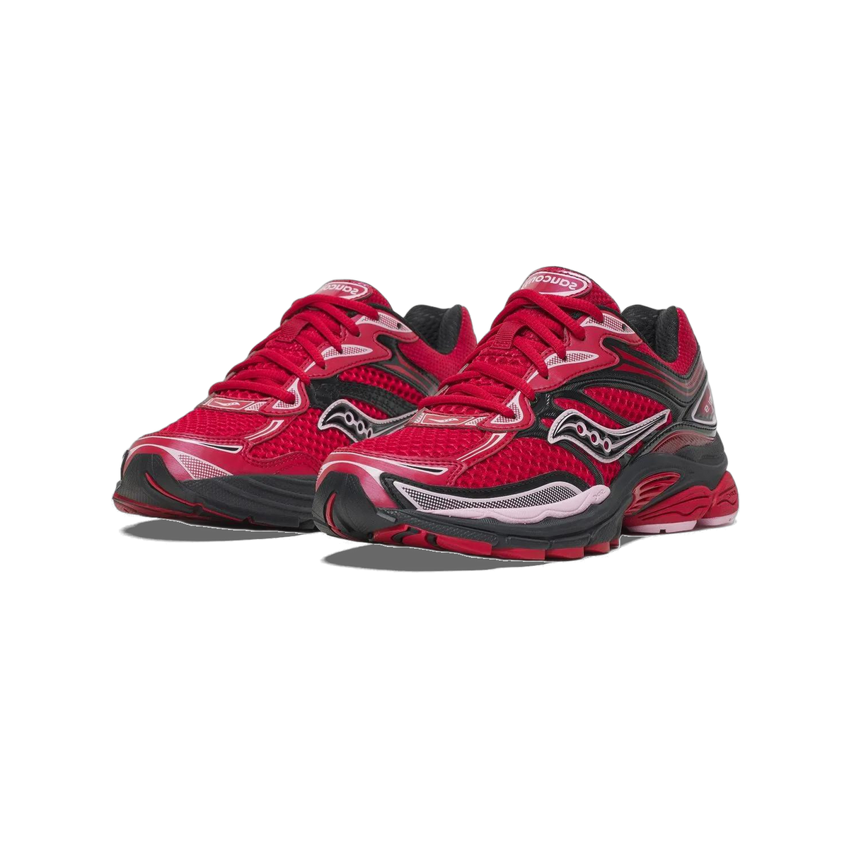Pair of red Saucony ProGrid Omni 9 sneakers with black overlays and pink accents, shown at an angled front view with Saucony logo on the tongue and side.