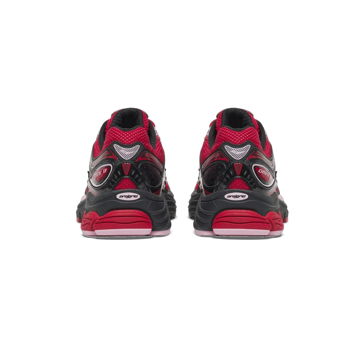 Rear view of a pair of red, black, and pink Saucony ProGrid Omni 9 sneakers showing the heel panels with Omni 9 branding and pink midsoles