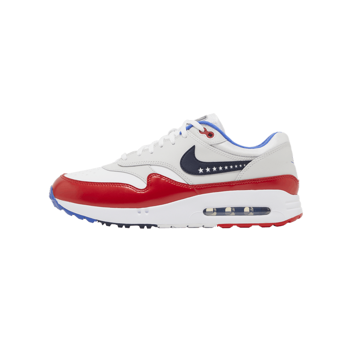 Lateral view of a white and red Nike Air Max 1 golf shoe with a navy swoosh lined with white stars and a visible Air sole unit, toe pointing left