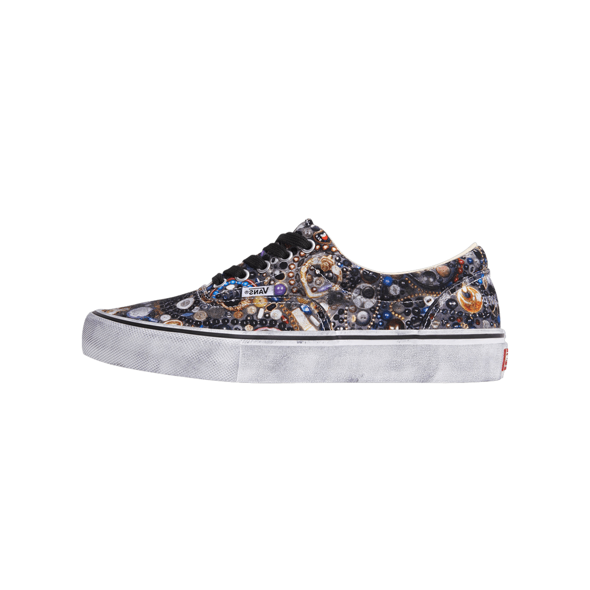 Side view of a Vans Era sneaker with an all-over multicolor beaded and jeweled pattern print, black laces, and a distressed grey-white sole.