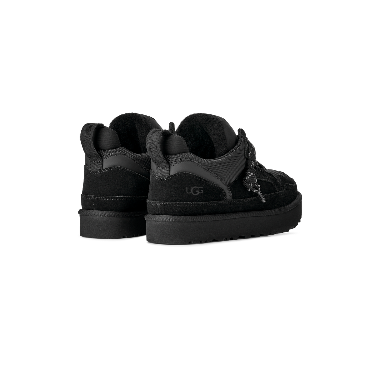 Rear view of a pair of black UGG Lowmel shoes showing suede uppers, shearling-lined collars, patterned laces, and ridged platform soles.