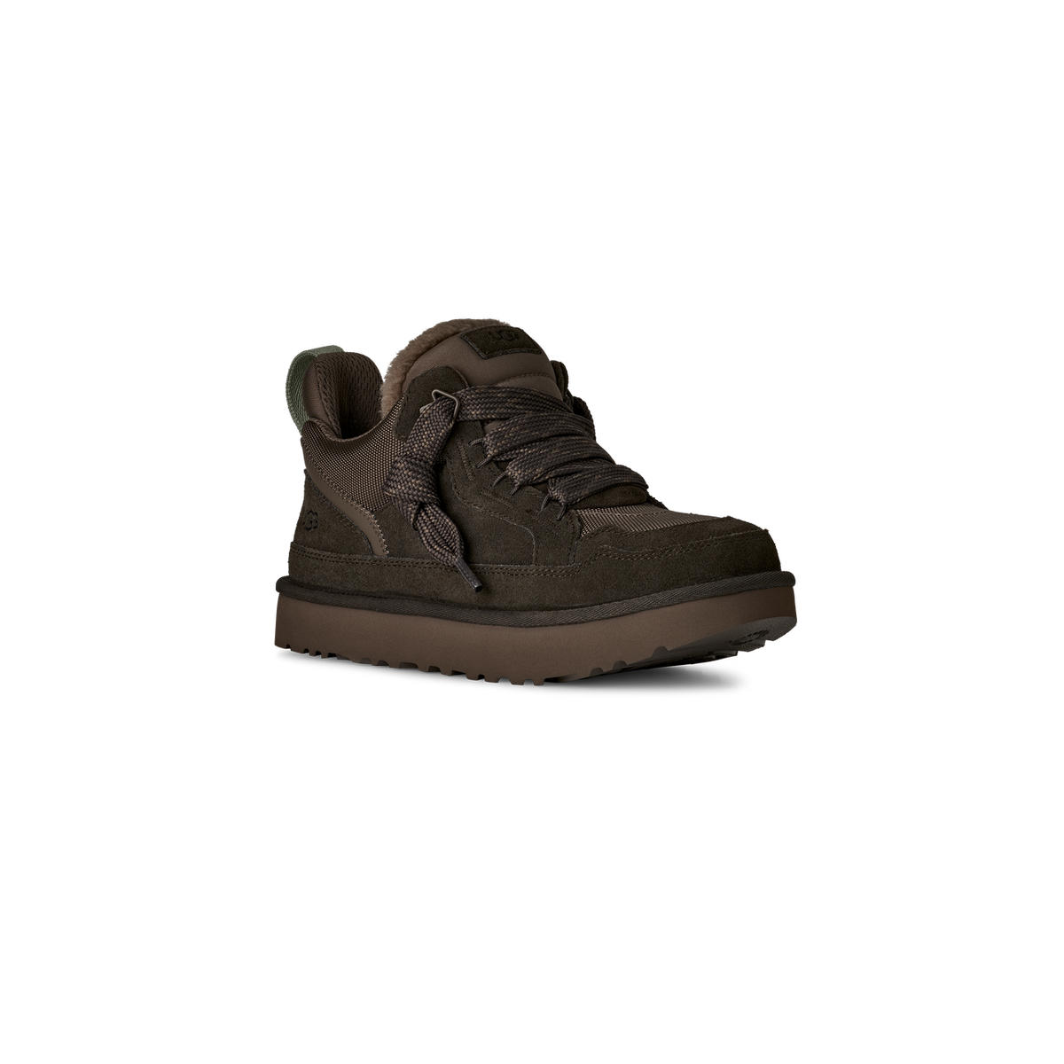 Dark brown UGG Lowmel boot shown from an inside-facing angle with toe pointing right, featuring suede and nylon panels, thick braided laces, shearling lining, and a green interior lining strip visible at the heel pull tab.