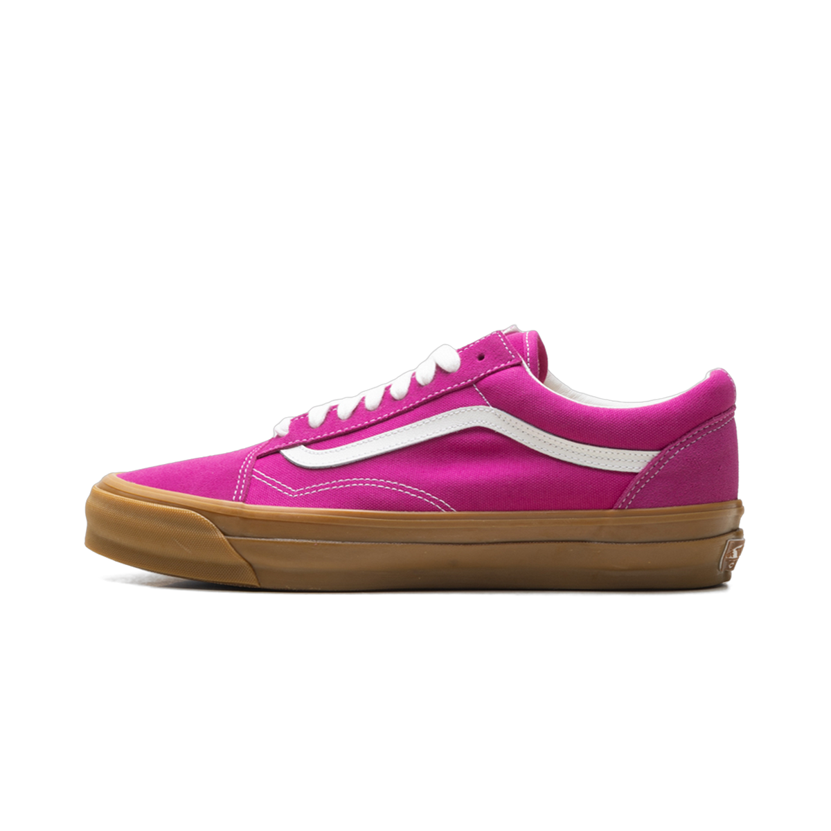 Side view of a pink Vans Old Skool sneaker with white side stripe, white laces, and a brown gum rubber sole.