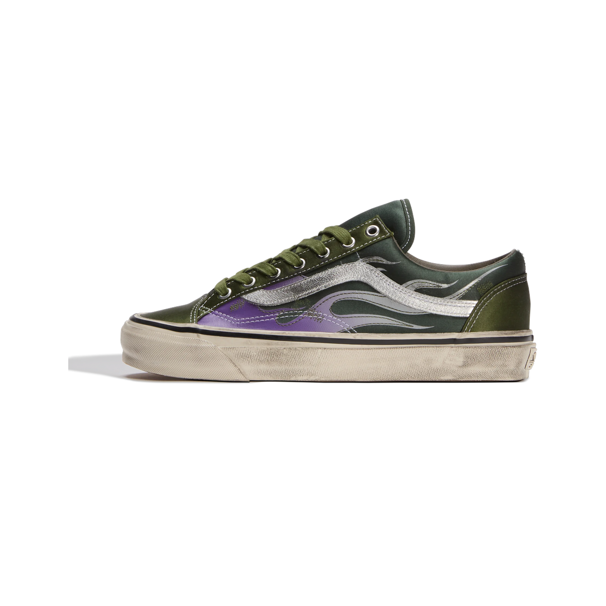 Side view of a green Vans Old Skool sneaker with a purple toe panel, silver flame graphics, and an aged off-white sole.