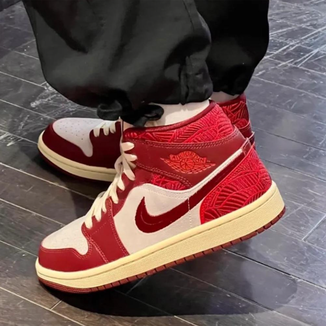 Air Jordan 1 Mid SE Tiki Leaf sneaker with tropical leaf graphics and premium leather upper