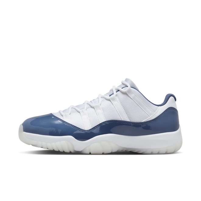Air Jordan 11 Retro Low Diffused Blue sneakers side view, white leather with blue accents, iconic low-top basketball shoe, premium athletic footwear, stylish and collectible