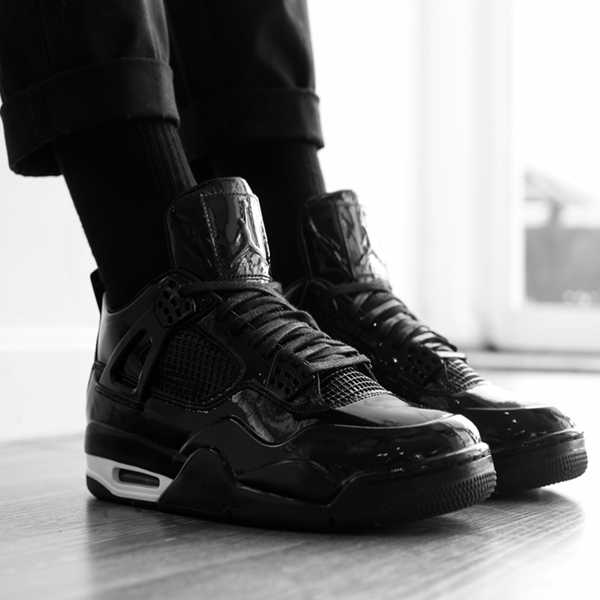 Air Jordan 4 11Lab4 sneaker with glossy patent leather upper premium construction and iconic Jordan 4 silhouette available at The Attic