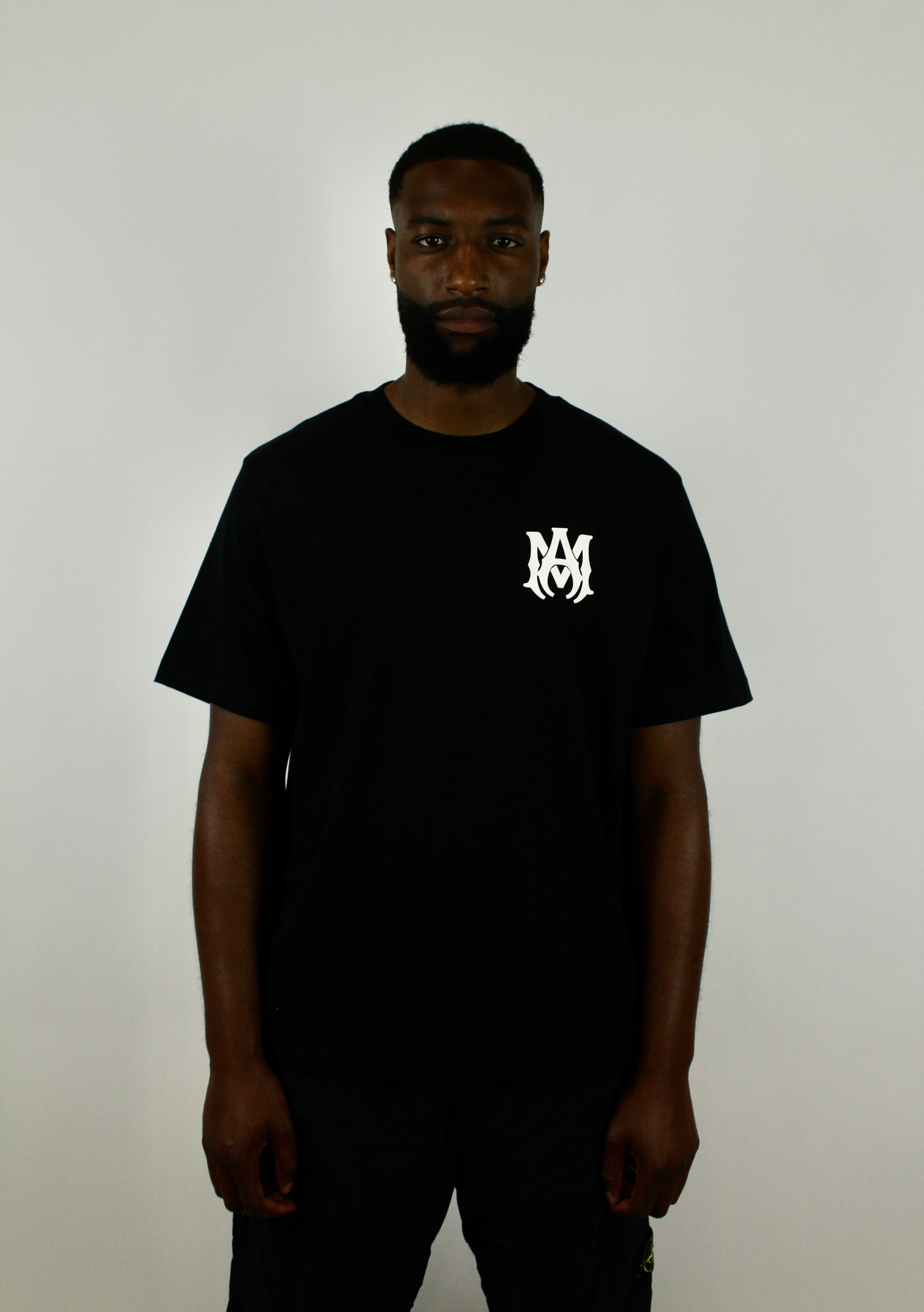 Amiri Core Logo Tee 'Black' – sleek black T-shirt with the signature Amiri core logo, premium soft cotton fabric, and minimalist style, ideal for everyday casual and streetwear looks.