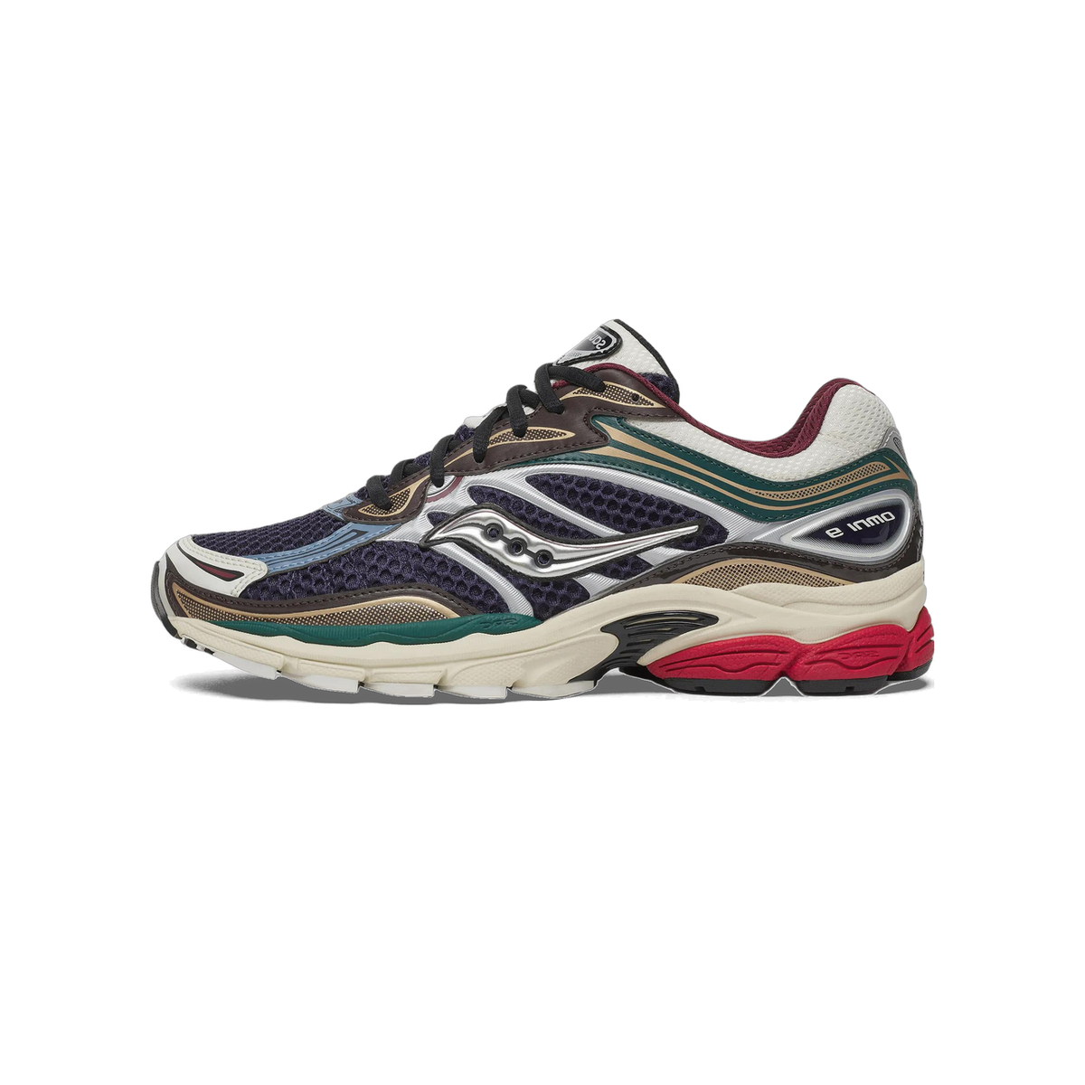 Left Saucony ProGrid Omni 9 sneaker shown from the outside in navy mesh with silver overlays, teal and burgundy trim, and a cream midsole with red and black outsole accents