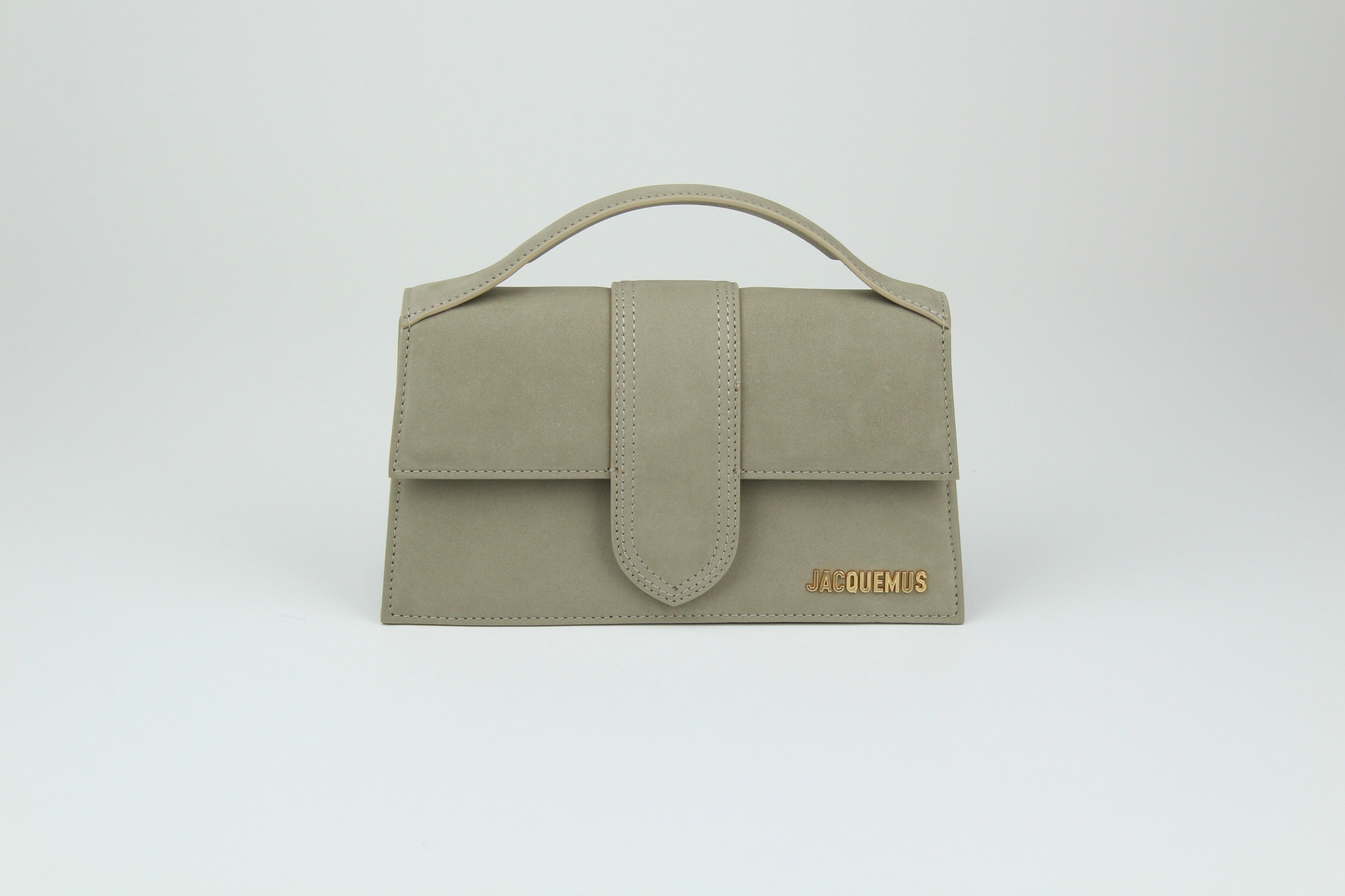 Jacquemus Le Grand Bambino 'Dark Beige' with smooth leather and clean structure. A neutral staple that balances everyday wear with quiet sophistication.