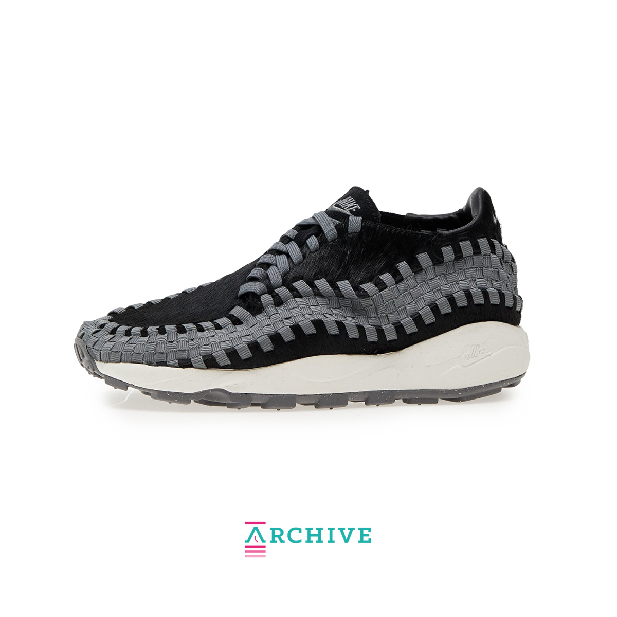 Nike Air Footscape Woven Black sneaker with woven side panels and asymmetrical lacing system